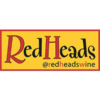 Logo reading 'RedHeads' with the handle '@redheadswine' on a yellow background with a red border.